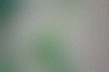 Subtle grainy texture with a smooth blend of green and grey in an abstract background