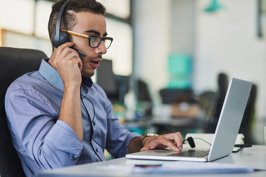 Technical support, laptop and man consultant in office with insurance policy review with online client. Headset, contact us and male call center agent with computer for internet crm consultation.