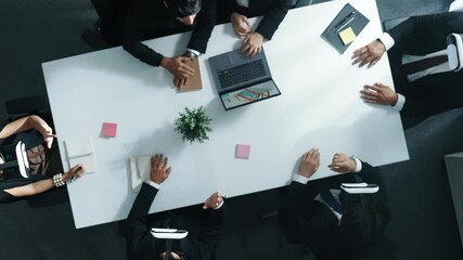 Top down aerial view of professional business team wear vr headset and receive financial data from laptop while use hand gesture to control marketing plan from manager laptop at meeting. Directorate.