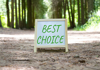 Best choice symbol. Best choice white chalk blackboard. Beautiful forest background. Business and...