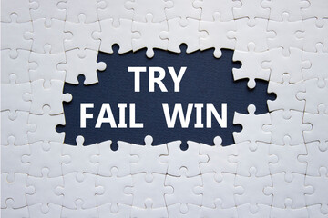 Try Fail Win symbol. Concept words Try Fail Win on white puzzle. Beautiful deep blue background. Business and Try Fail Win concept. Copy space.