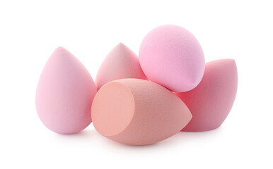 Pink and beige makeup sponges isolated on white
