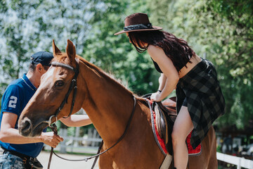 Young woman learning horseback riding with the assistance of an instructor on a sunny day....