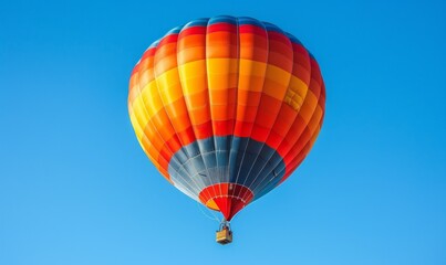 Obraz premium An inflated hot air balloon ascends into a clear blue sky