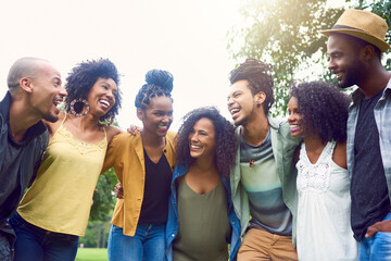 Happy, laughing and black people with hug, outdoor and outing for anniversary of friendship in park. Nature, smile and celebration in reunion, love and embrace in Costa Rica, travel and vacation
