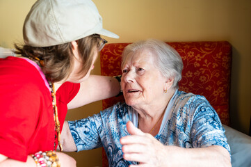 95 yo white grandmother greeting her 41 yo friend with Down Syndrome, Tienen, Belgium