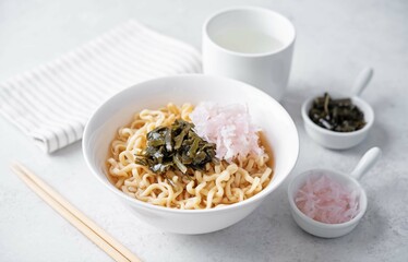 Ramen noodles with seaweed and radish in a bowl