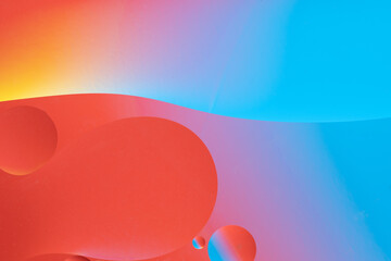 Colorful abstract background with dynamic bubble shapes. Red and blue gradient.