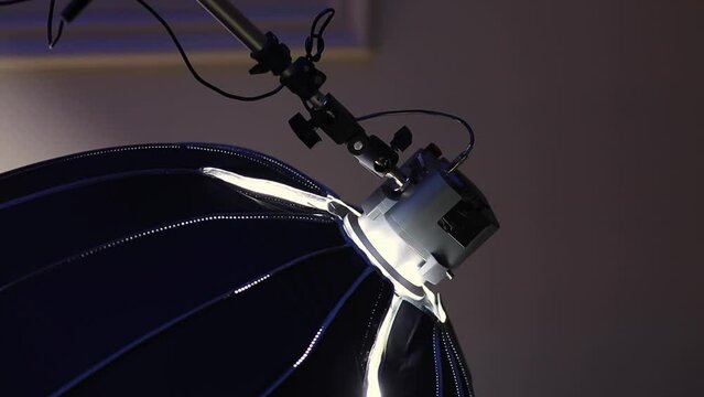 Portable video light with octobox. Studio lighting equipment with octobox, close-up. vertical video