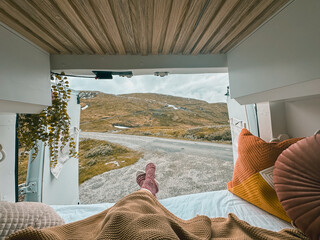 Vanlife back view from the van overseeing mountains in Norway