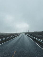 Gloomy mountain road in Norway Scandinavian foggy road 