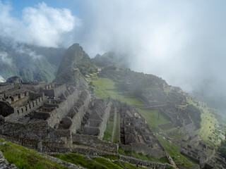 Early morning before the crowds arrive and before the clouds completely clear at Machu Picchu.