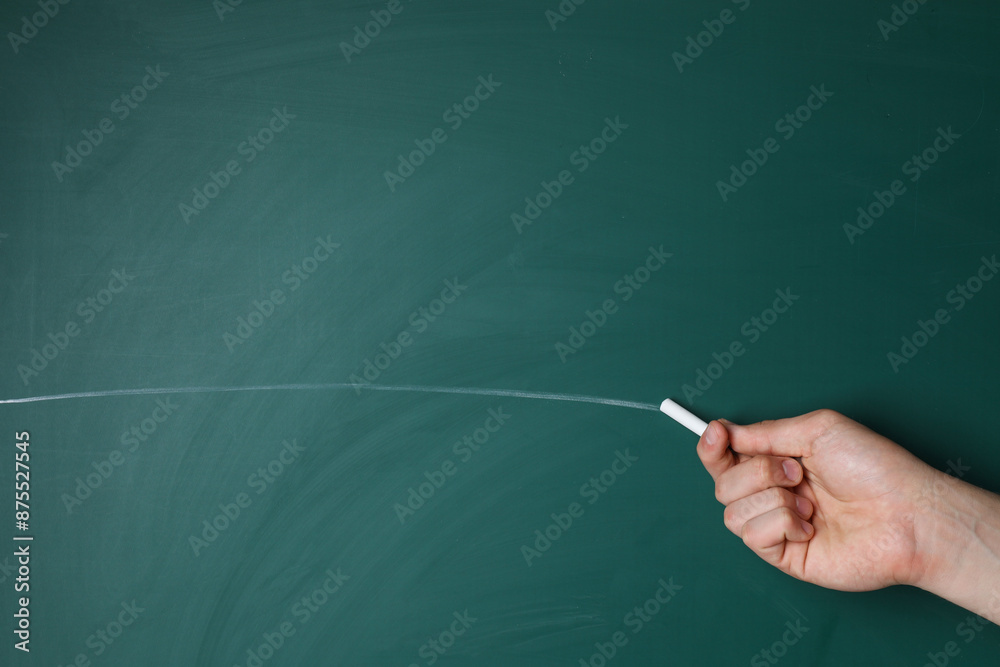 Poster teacher writing with chalk on green chalkboard, closeup. space for text