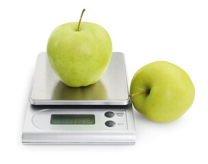 Kitchen scale with apples isolated on white