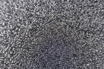 Texture of coarse sandpaper as background, closeup