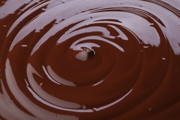 Tasty melted chocolate as background, closeup view