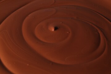 Tasty melted chocolate as background, closeup view