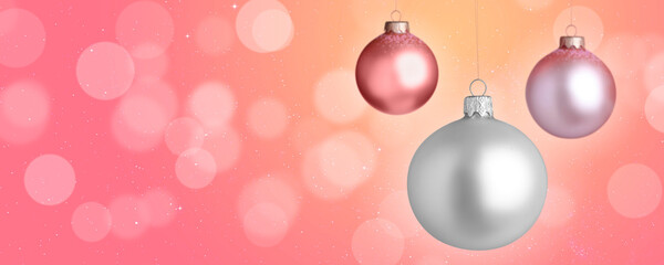 Christmas balls against blurred background with bokeh effect, space for text. Banner design