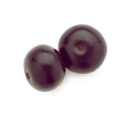 Fresh ripe acai berries isolated on white, top view