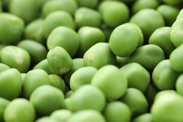 Fresh raw green peas as background, closeup