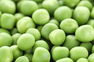 Fresh raw green peas as background, closeup