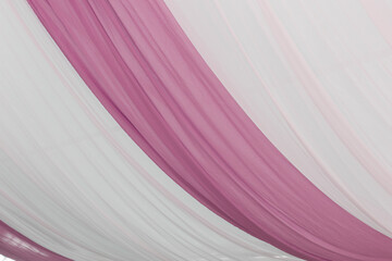 A view of a pink curtain tent fabric, as a background.