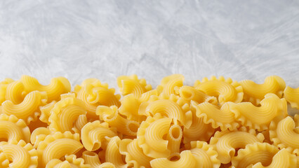 Dry Creste di Gallo Pasta on Сoncrete, Traditional Italian Cuisine, Copy Space