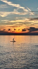 silhouette of a person in a boat