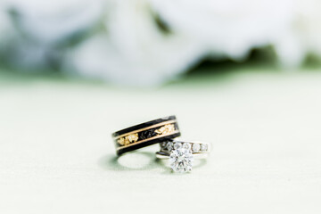 Beautiful Wedding Bands On Green Tablecloth