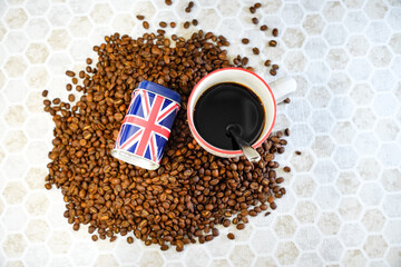 A cup of coffee and coffee beans