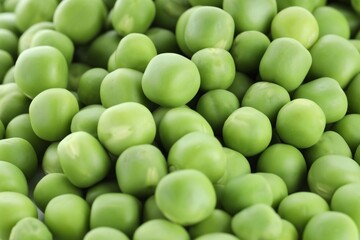 Fresh raw green peas as background, closeup