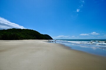 beach and sea with sky and shipwreck