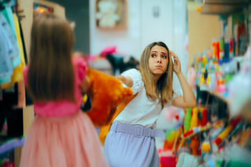 Mother and Daughter Fighting over a New toy in a Store. Unruly bratty kid asking for new toys...
