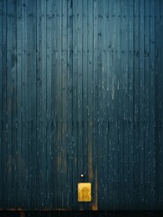 an old wooden door with a yellow light on it