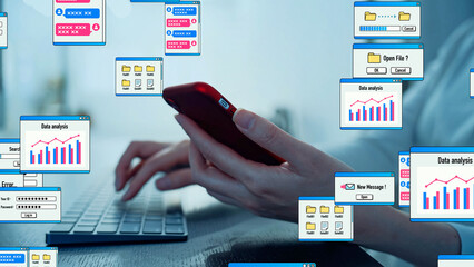 A woman using smartphone in office and computer prompt concept.