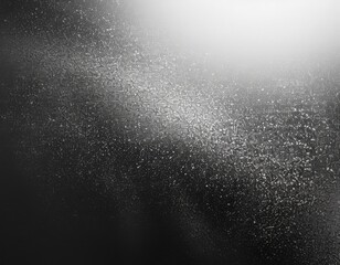 Abstract Monochrome Gradient: A Sophisticated Black and White Granular Texture for Sophisticated Background Design.