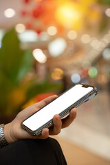 Woman hand holding blank screen mock up mobile phone. Blank smartphone screen for display montage