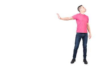 Angry male showing stop gesture and pouting lips in white studio