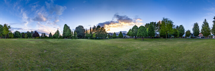 Pathway in a city park. Colorful Sunset Sky. Panorama. Chilliwack, BC, Canada