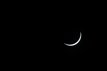Total eclipse waning as moon begins to uncover the sun
