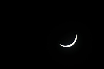 Total eclipse waning as moon begins to uncover the sun