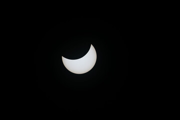 Total eclipse waning as moon begins to uncover the sun