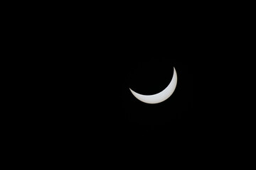 Total eclipse waning as moon begins to uncover the sun