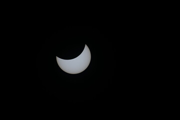 Total eclipse waning as moon begins to uncover the sun