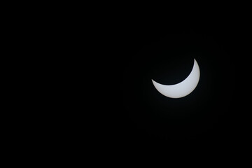 Total eclipse waning as moon begins to uncover the sun