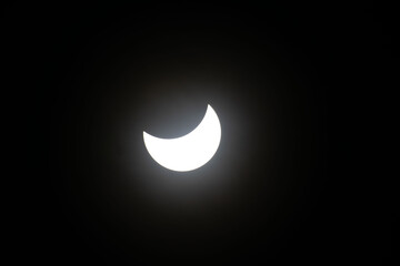 Total eclipse waning as moon begins to uncover the sun