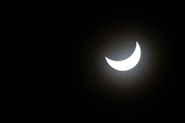 Total eclipse waning as moon begins to uncover the sun