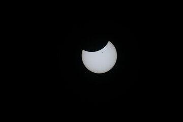 Total eclipse waning as moon begins to uncover the sun
