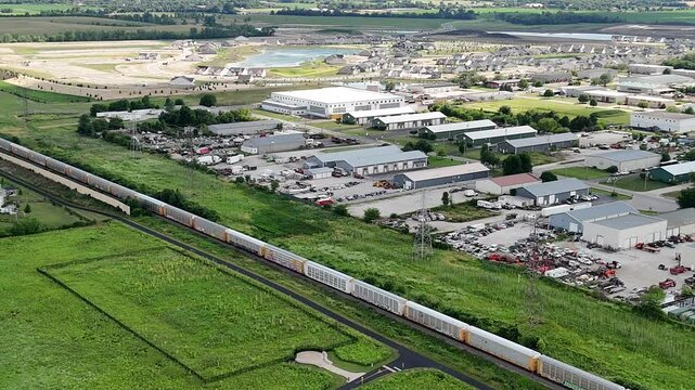 Train Traversing Scenic Countryside Neighborhood (Drone Footage)