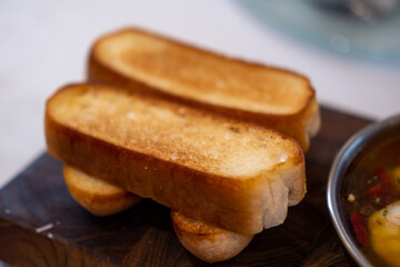 Sliced bread prepared to eat with Tapas, an appetizer or snack in Spanish cuisine
